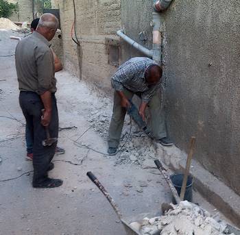 Men working on house